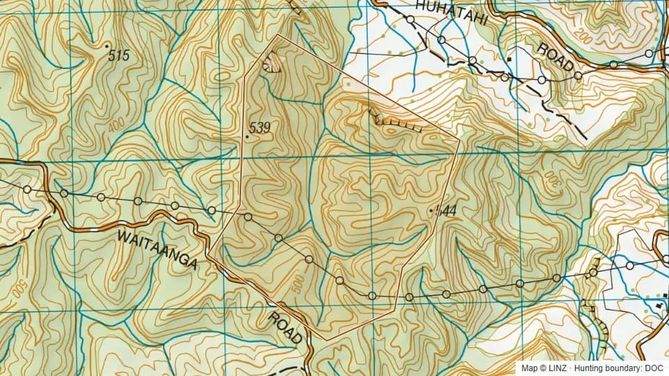 Topographic map of Huhatahi Conservation Area in Manawatu-Wanganui, New Zealand, with the DOC hunting boundary outlined.