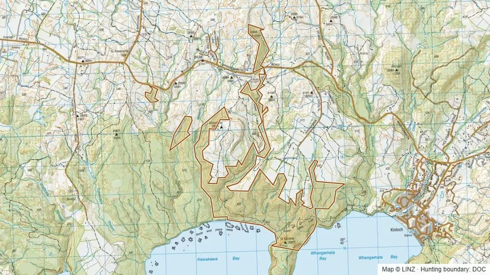 Topographic map of Kawakawa Bay Scenic Reserve in Waikato, New Zealand, with the DOC hunting boundary outlined.