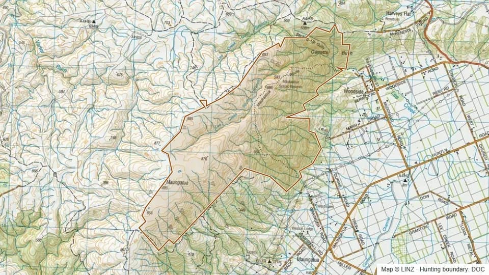 Topographic map of Maungatua in Otago, New Zealand, with the DOC hunting boundary outlined.