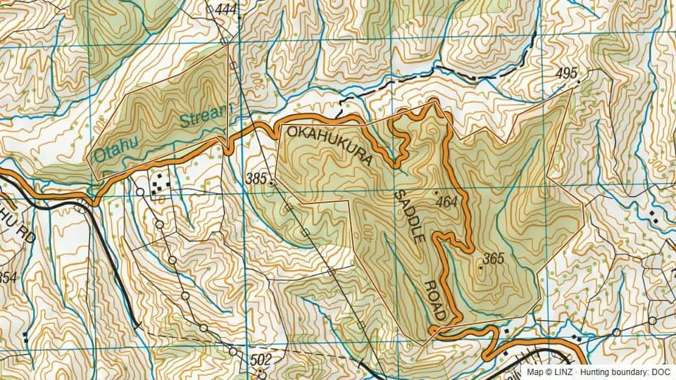 Topographic map of Okahukura Scenic Reserve in Manawatu-Wanganui, New Zealand, with the DOC hunting boundary outlined.