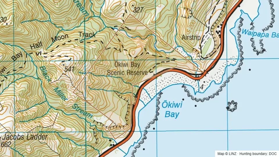 Topographic map of Okiwi Bay Scenic Reserve in Canterbury, New Zealand, with the DOC hunting boundary outlined.