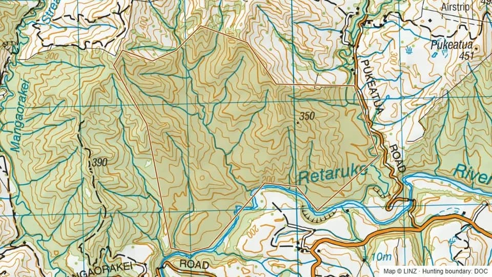 Topographic map of Pukeatua Conservation Area in Manawatu-Wanganui, New Zealand, with the DOC hunting boundary outlined.