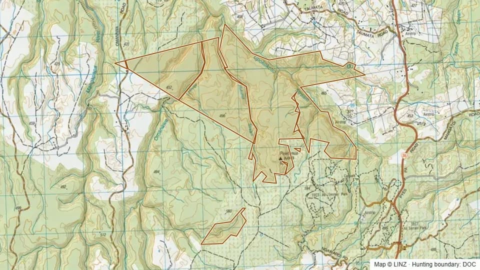 Topographic map of Puwhenua Forest in Bay of Plenty, New Zealand, with the DOC hunting boundary outlined.