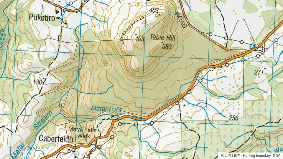 Topographic map of Table Hill in Otago, New Zealand, with the DOC hunting boundary outlined.