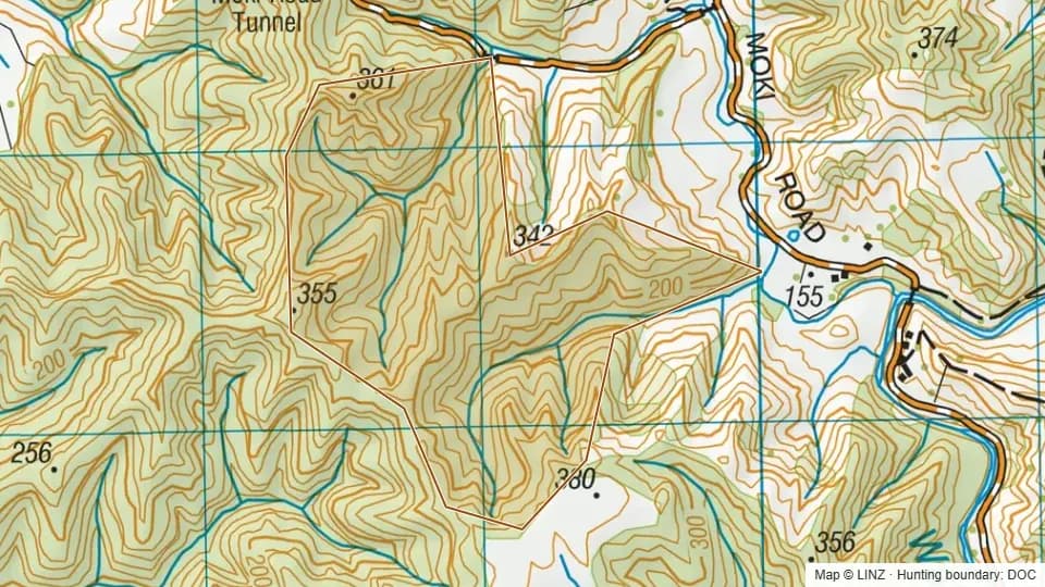 Topographic map of Tangitu Conservation Area in Taranaki, New Zealand, with the DOC hunting boundary outlined.