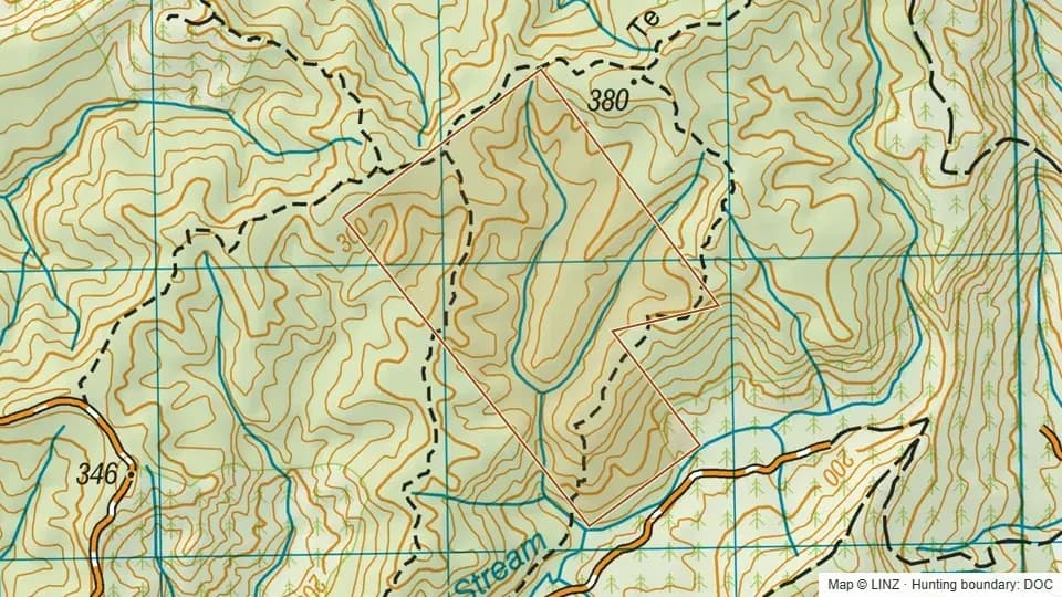 Topographic map of Totara Peak Scenic Reserve in Auckland, New Zealand, with the DOC hunting boundary outlined.