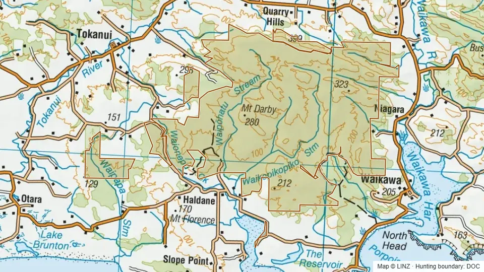 Topographic map of Waikawa in Southland, New Zealand, with the DOC hunting boundary outlined.